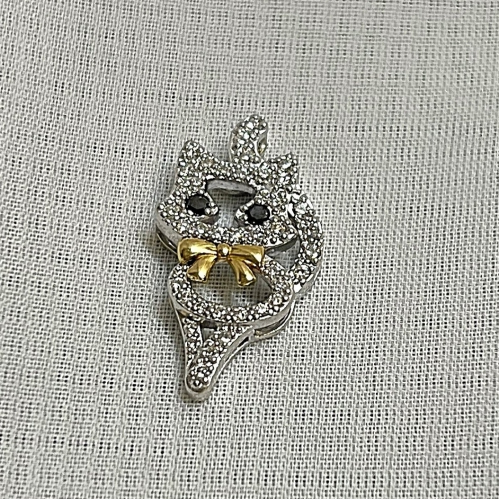 Real K18 white gold and diamond pendant